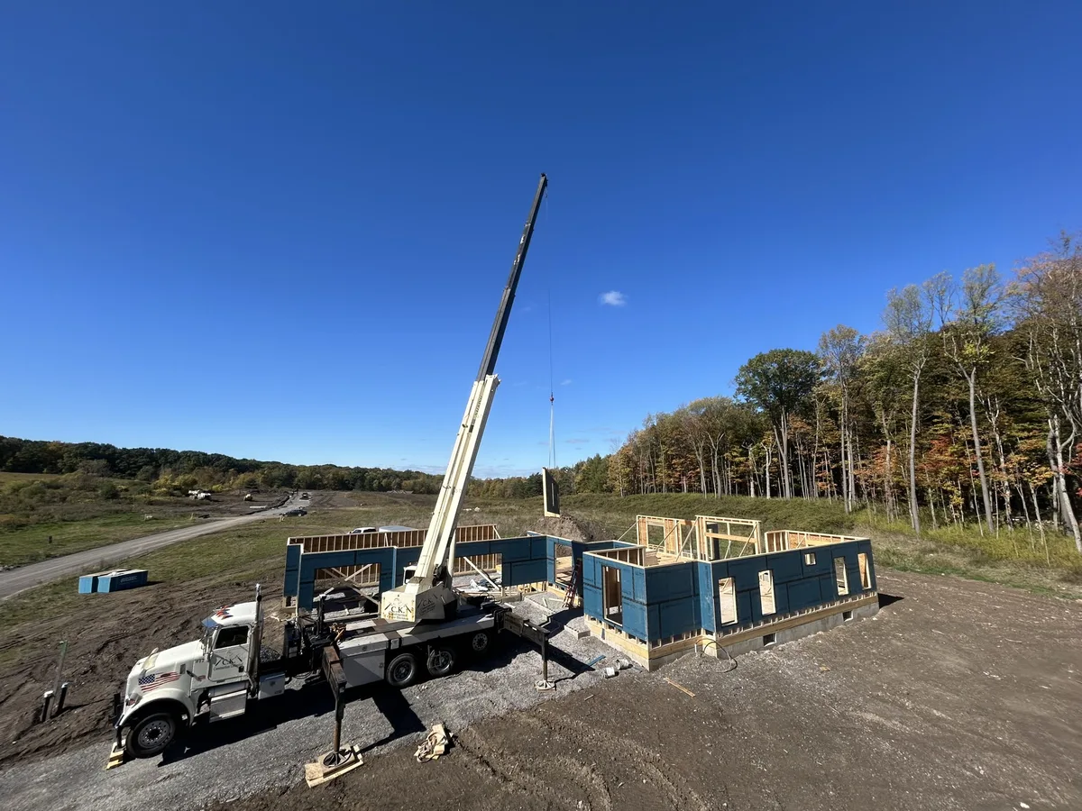 Wall panels craned and set on the foundation — Upstate NY